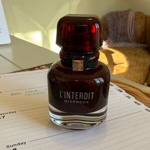 Givenchy L'Interdit with Deep Red Cap. 7/8 full. 1.1 oz bottle